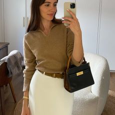 liv perez wearing sweater and skirt